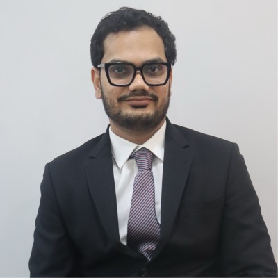 Ravishekhar Pandey in a dark suit and tie